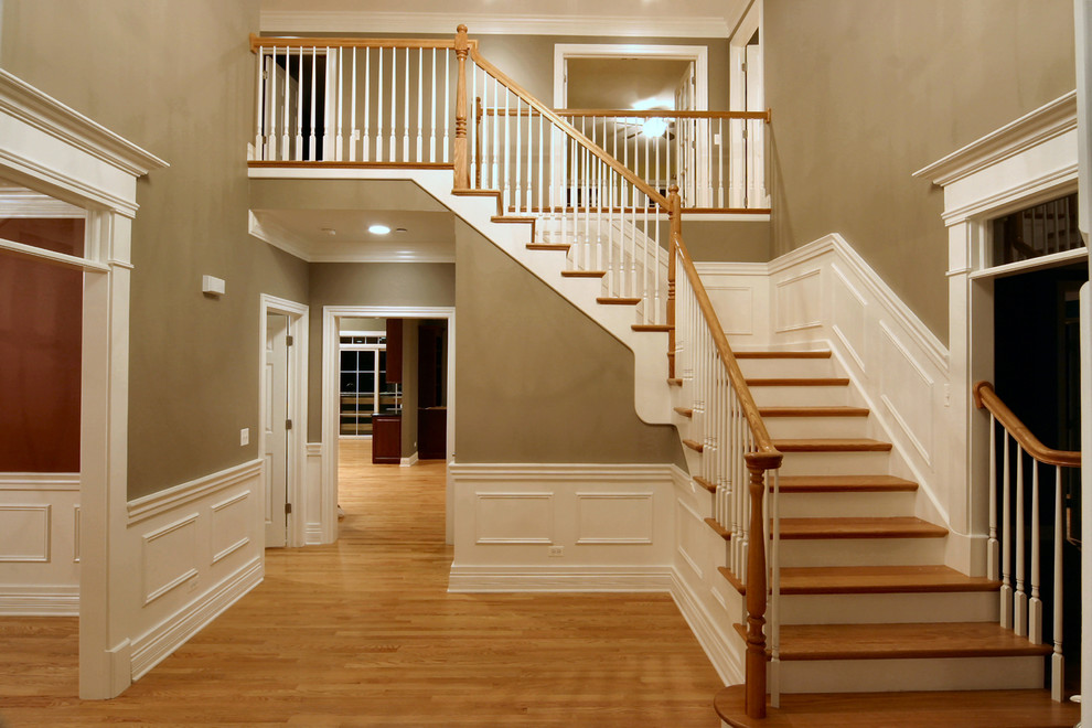 Photo of a medium sized traditional wood straight staircase in Chicago.