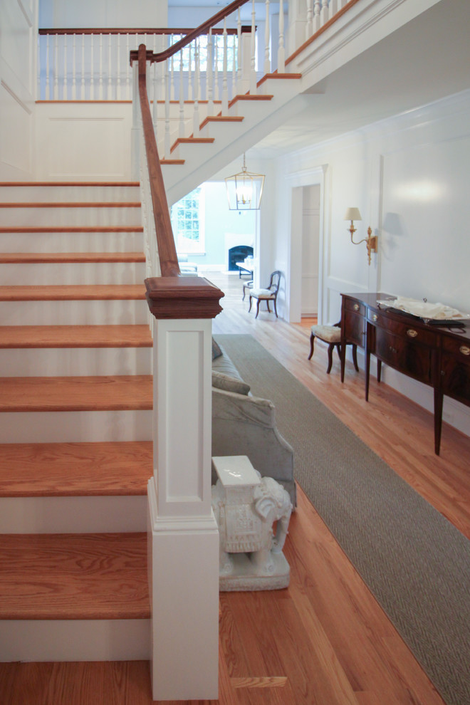 Inspiration for a mid-sized craftsman wooden u-shaped wood railing staircase remodel in DC Metro with wooden risers