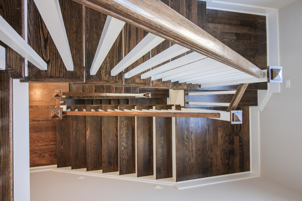 Foto di una scala a "U" moderna di medie dimensioni con pedata in travertino, alzata in legno e parapetto in legno