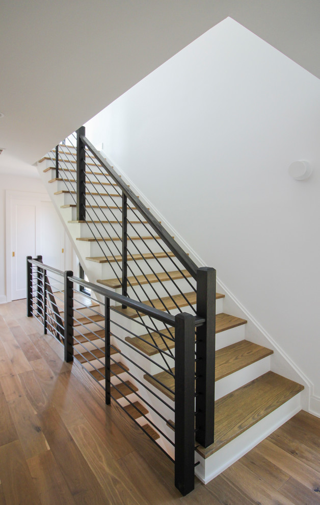 Large modern wood straight mixed railing staircase in DC Metro with wood risers.