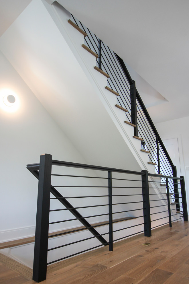 Staircase - large modern wooden straight mixed material railing staircase idea in DC Metro with wooden risers