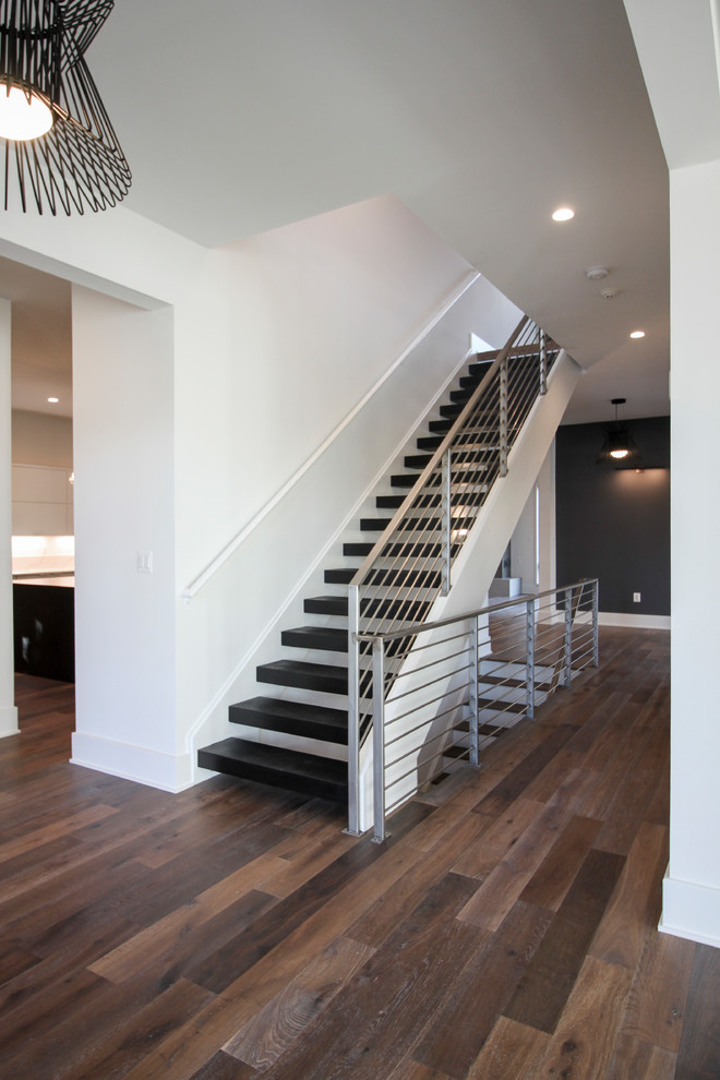 Inspiration for a large contemporary wood floating metal railing staircase in DC Metro.