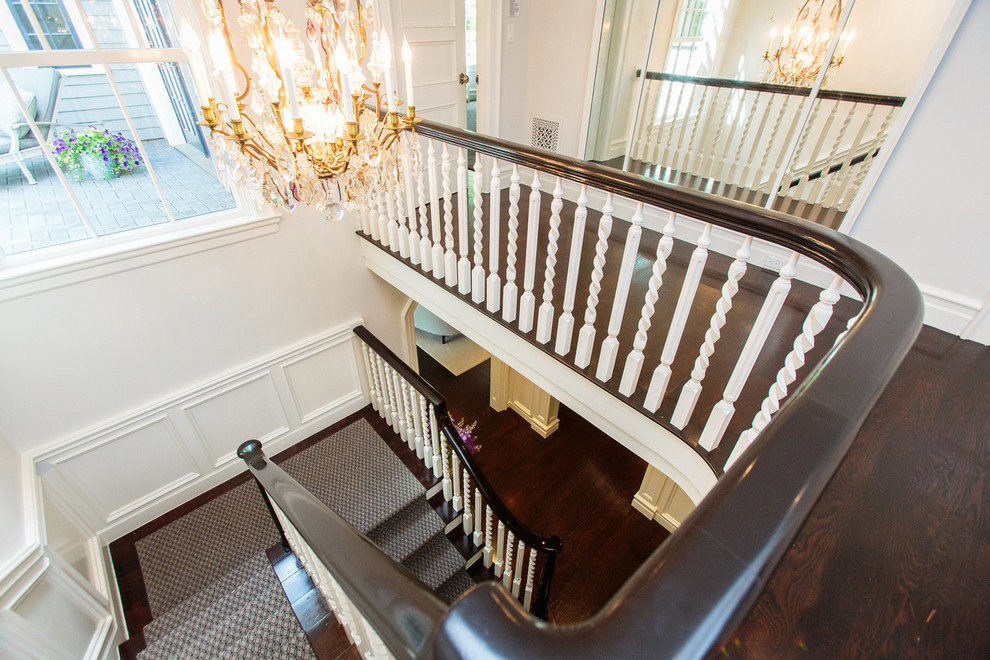 Staircase - large victorian carpeted l-shaped staircase idea in Boston with wooden risers