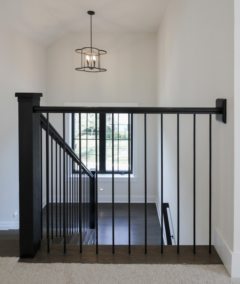 Свежая идея для дизайна: п-образная деревянная лестница среднего размера в современном стиле с деревянными ступенями и металлическими перилами - отличное фото интерьера