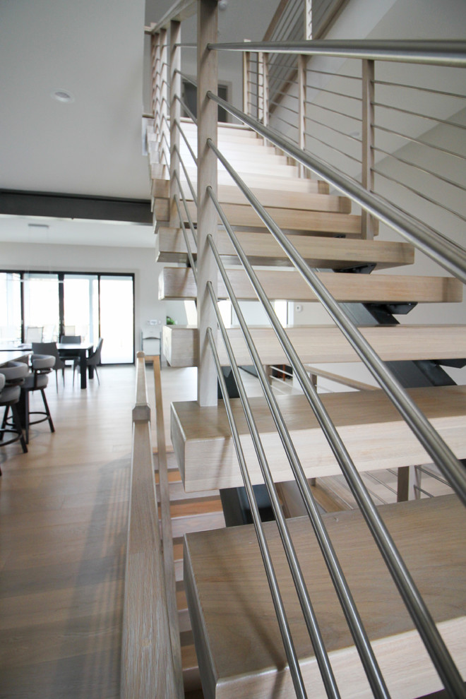 Staircase - mid-sized contemporary wooden floating metal railing staircase idea in DC Metro