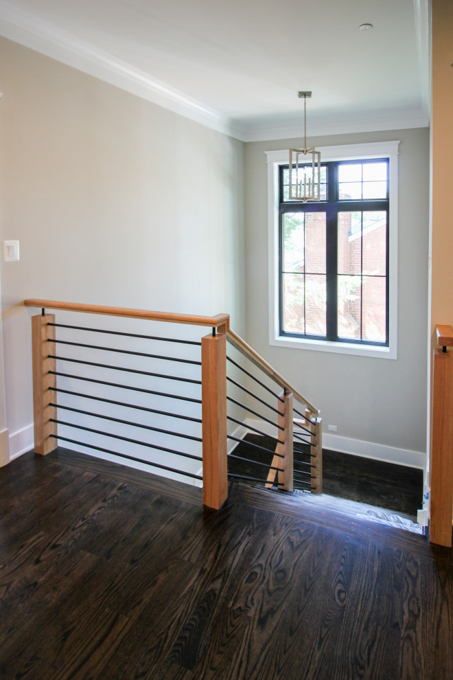 Example of a mid-sized eclectic wooden u-shaped mixed material railing staircase design in DC Metro with wooden risers