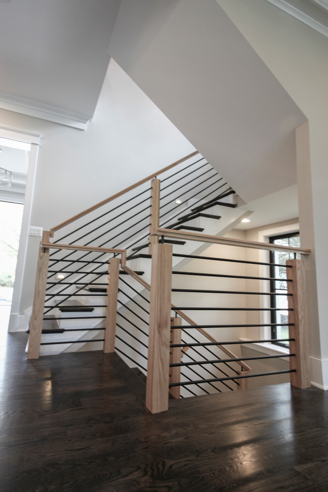 Example of a mid-sized eclectic wooden u-shaped mixed material railing staircase design in DC Metro with wooden risers