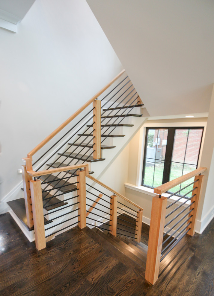 Exemple d'un escalier éclectique en U de taille moyenne avec des marches en bois, des contremarches en bois et un garde-corps en matériaux mixtes.