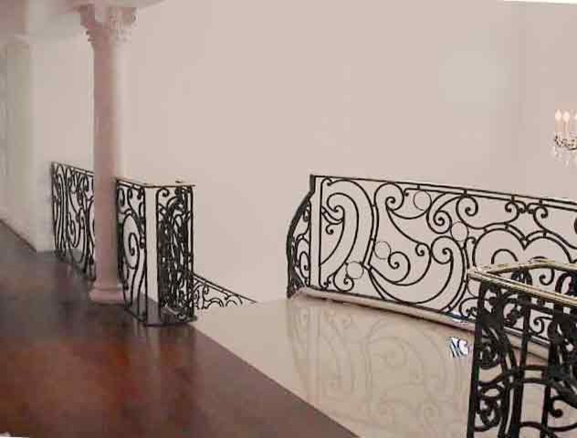 Inspiration for a large shabby-chic style wooden curved metal railing staircase remodel in DC Metro with wooden risers