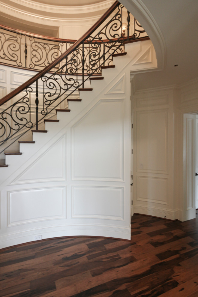 Design ideas for a large bohemian wood curved mixed railing staircase in DC Metro with wood risers.