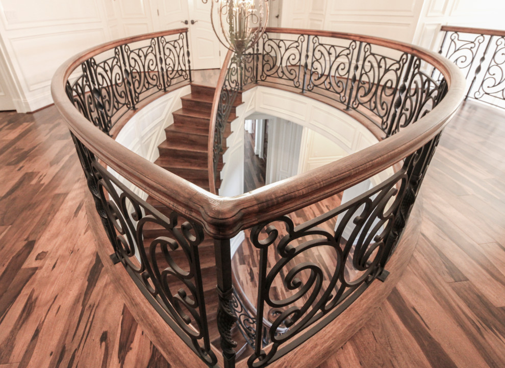 This is an example of a large bohemian wood curved mixed railing staircase in DC Metro with wood risers.
