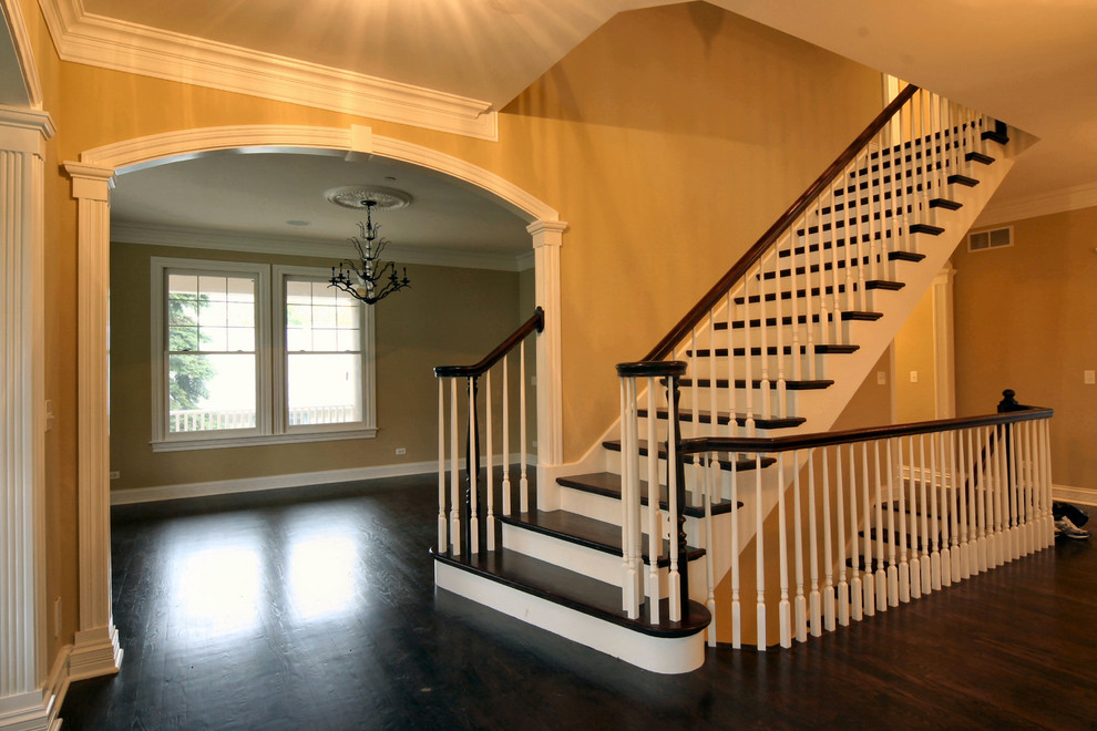 Design ideas for a medium sized classic wood straight staircase in Chicago with painted wood risers.