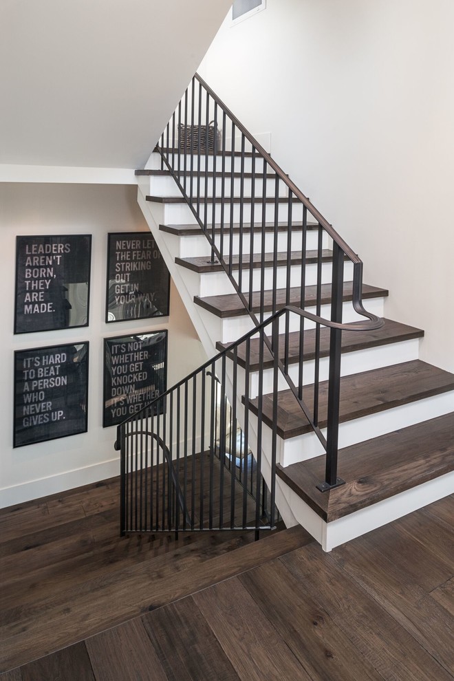 Design ideas for a large classic wood l-shaped staircase with painted wood risers.
