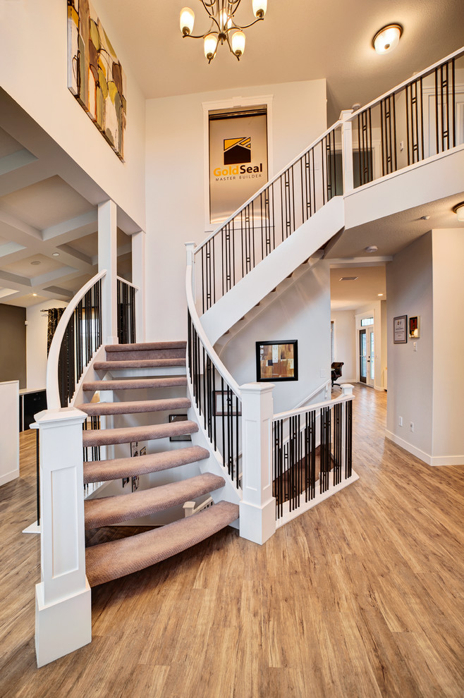 Staircase - large traditional carpeted floating staircase idea in Toronto with painted risers