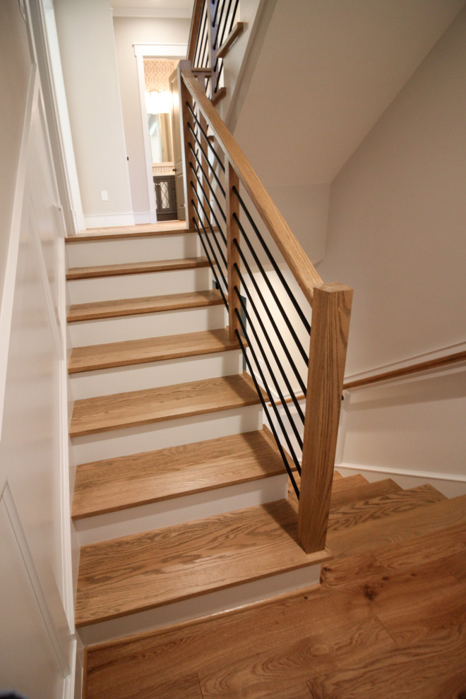 Small retro wood u-shaped mixed railing staircase in DC Metro with painted wood risers.