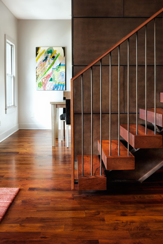 Large trendy wooden floating open staircase photo in Austin
