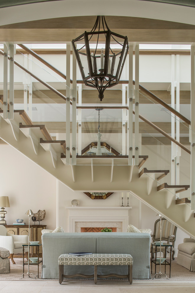 This is an example of a large mediterranean wood straight staircase in Miami with open risers.