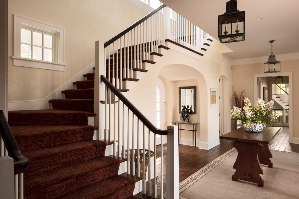 Photo of a large beach style wood railing staircase in Milwaukee.