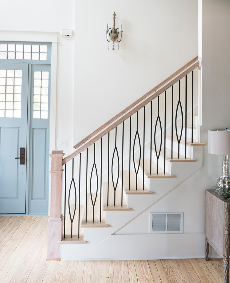 Example of a minimalist wooden straight staircase design in Houston with wooden risers