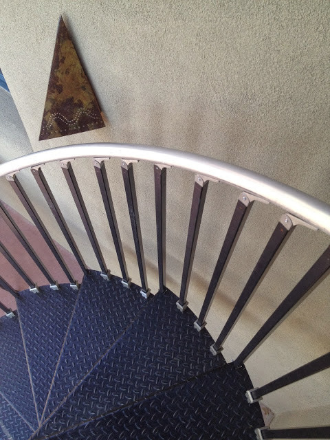 Inspiration for an industrial metal spiral staircase remodel in Albuquerque