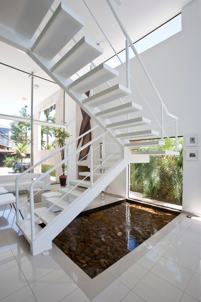 Пример оригинального дизайна: угловая лестница в современном стиле без подступенок
