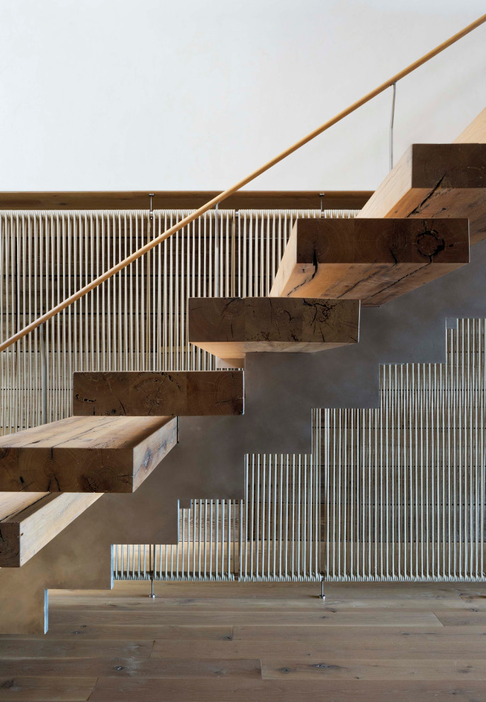 Design ideas for a medium sized coastal wood floating wood railing staircase in Other with metal risers.