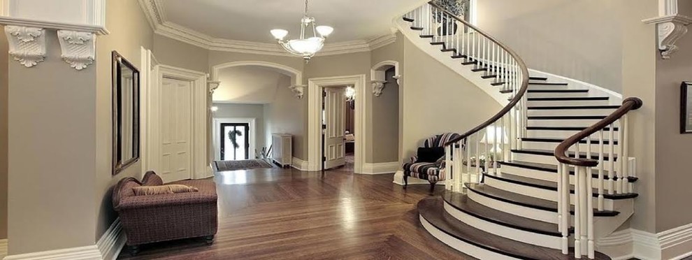Inspiration for a large timeless wooden curved wood railing staircase remodel in Los Angeles with painted risers