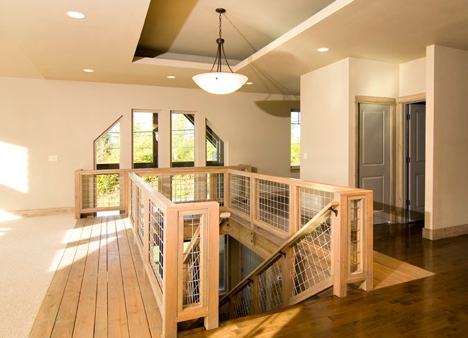 Photo of a medium sized traditional wood straight staircase in Seattle with open risers.
