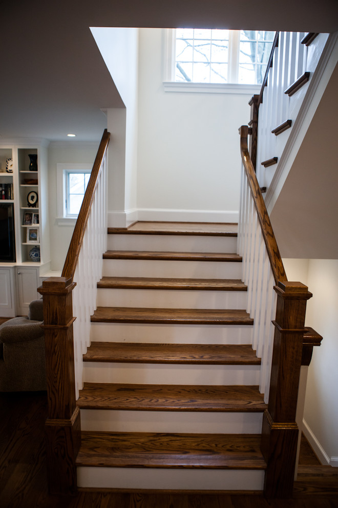 Medium sized rural wood curved staircase in DC Metro with wood risers.