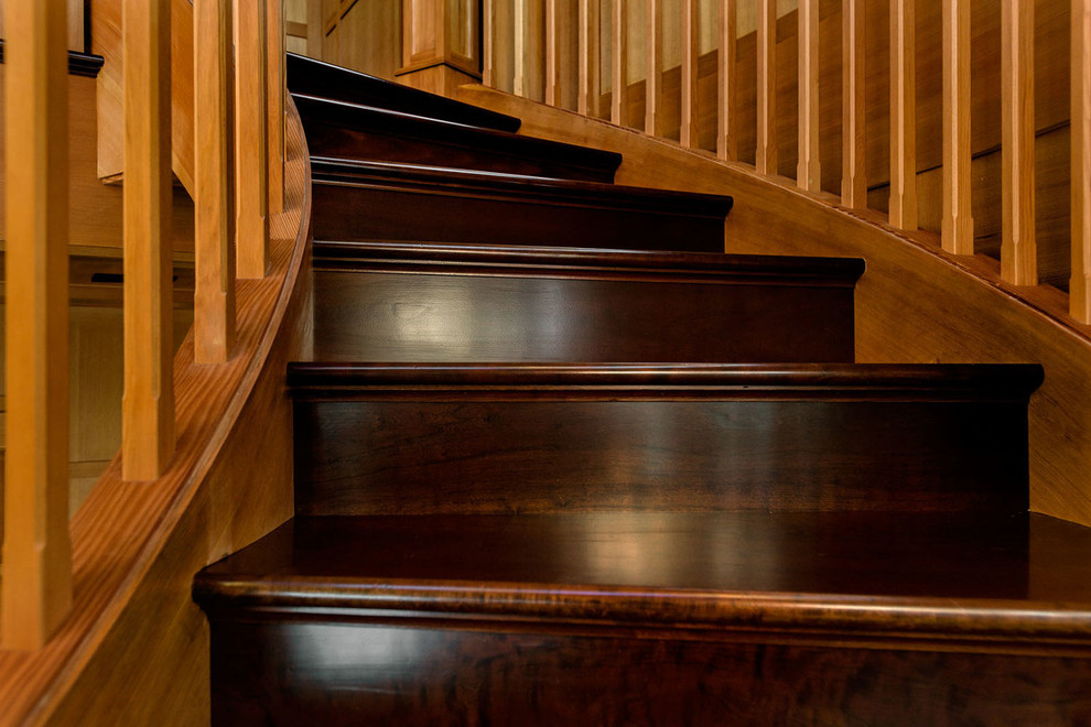 Inspiration for a large rustic wooden spiral staircase remodel in Burlington with wooden risers