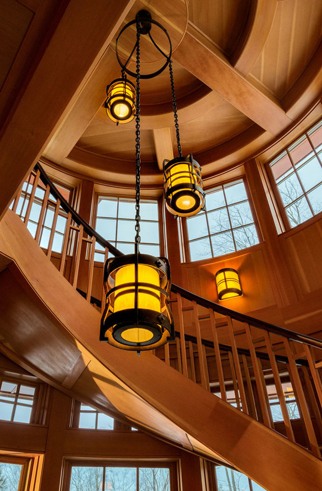 Staircase - large rustic wooden spiral staircase idea in Burlington with wooden risers