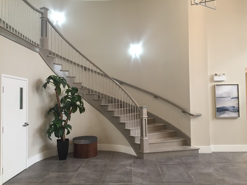 Inspiration for a large modern curved staircase remodel in Other