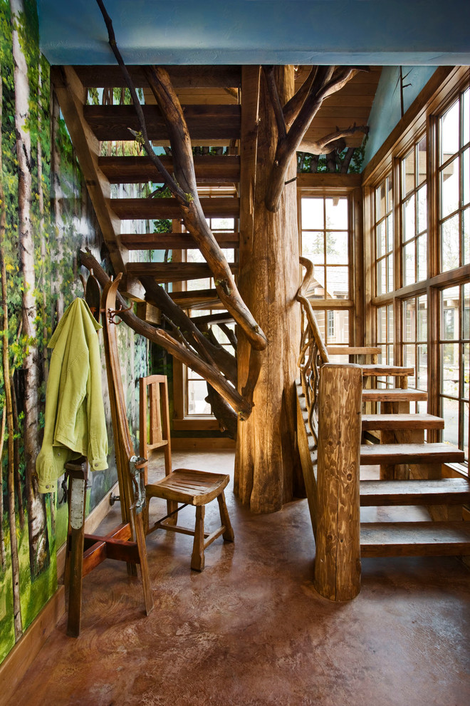 Idée de décoration pour un escalier sans contremarche chalet avec des marches en bois.