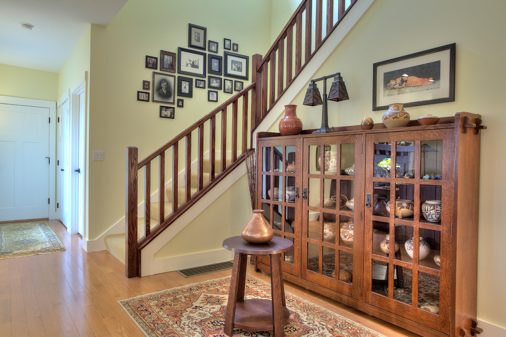 Mid-sized elegant carpeted l-shaped wood railing staircase photo in Boston with carpeted risers
