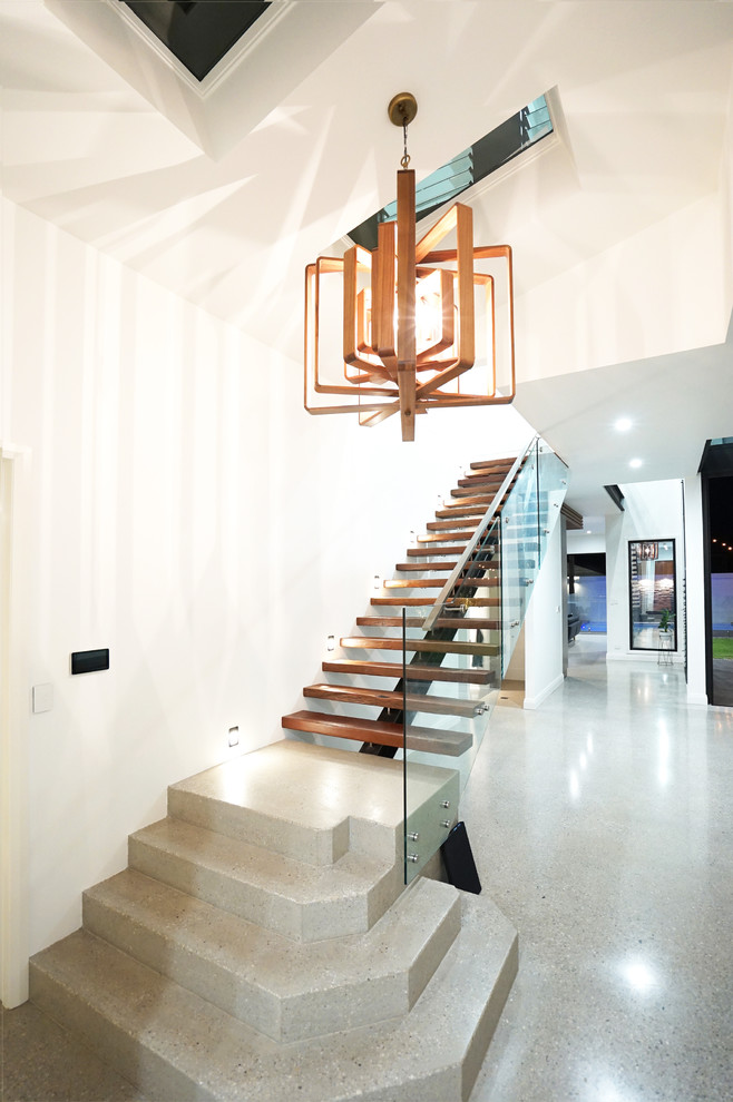 This is an example of a contemporary wood straight staircase in Brisbane with open risers.