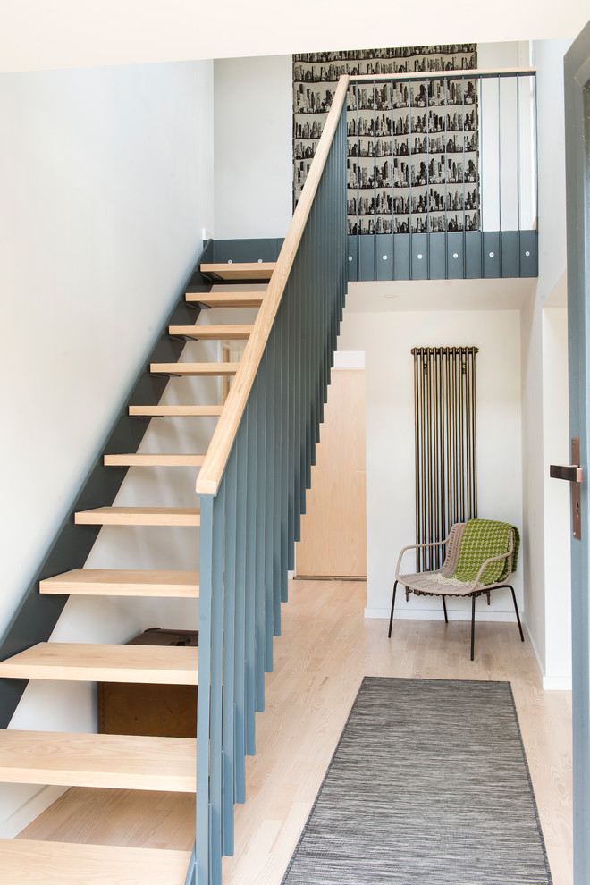 Inspiration for a scandinavian wood straight staircase in Other with open risers.