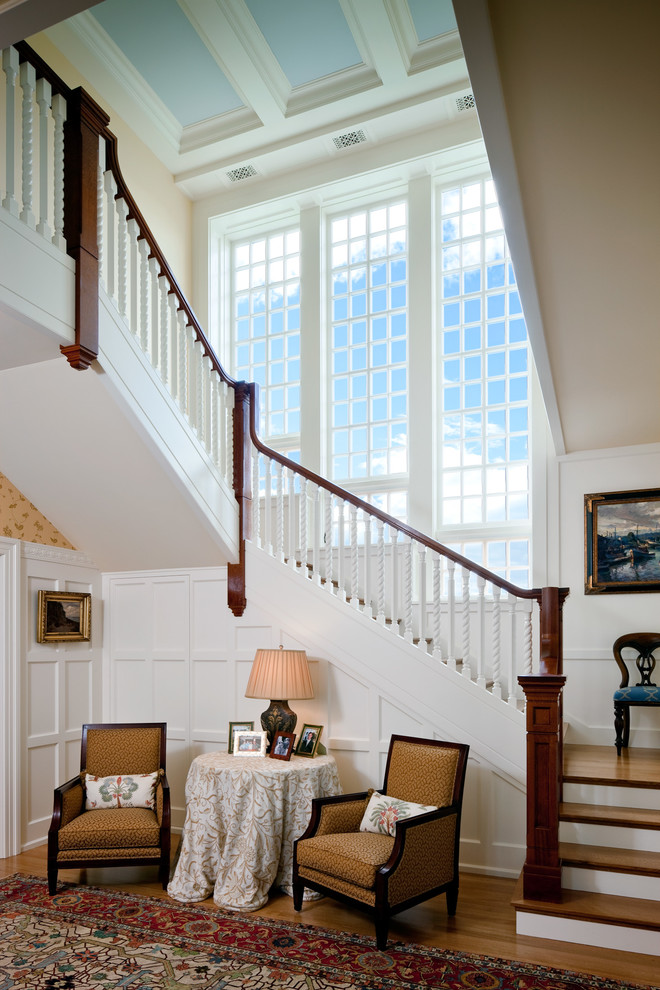 Elegant wooden l-shaped staircase photo in Boston with wooden risers