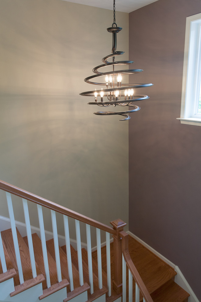 Medium sized classic wood l-shaped staircase in DC Metro with wood risers.