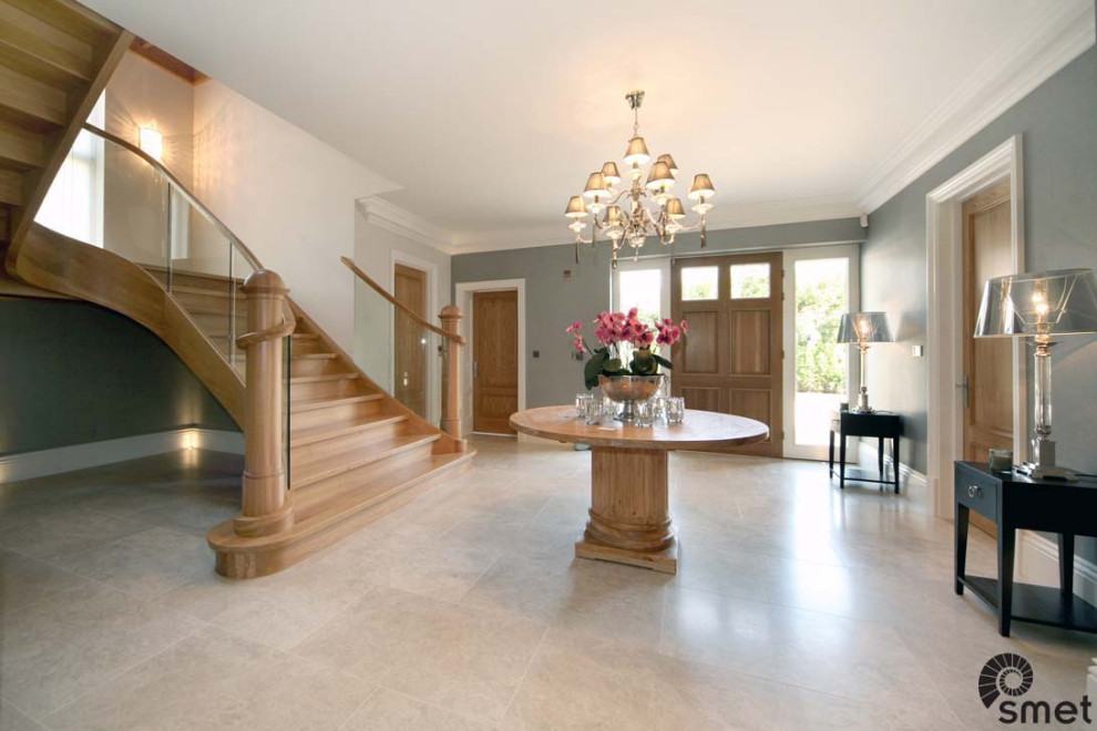 Contemporary wood curved glass railing staircase in Surrey with wood risers.