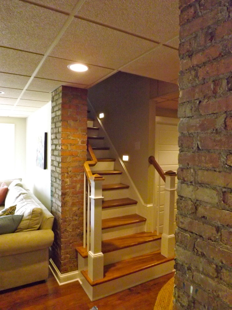 Inspiration for a mid-sized timeless wooden straight staircase remodel in Other with wooden risers