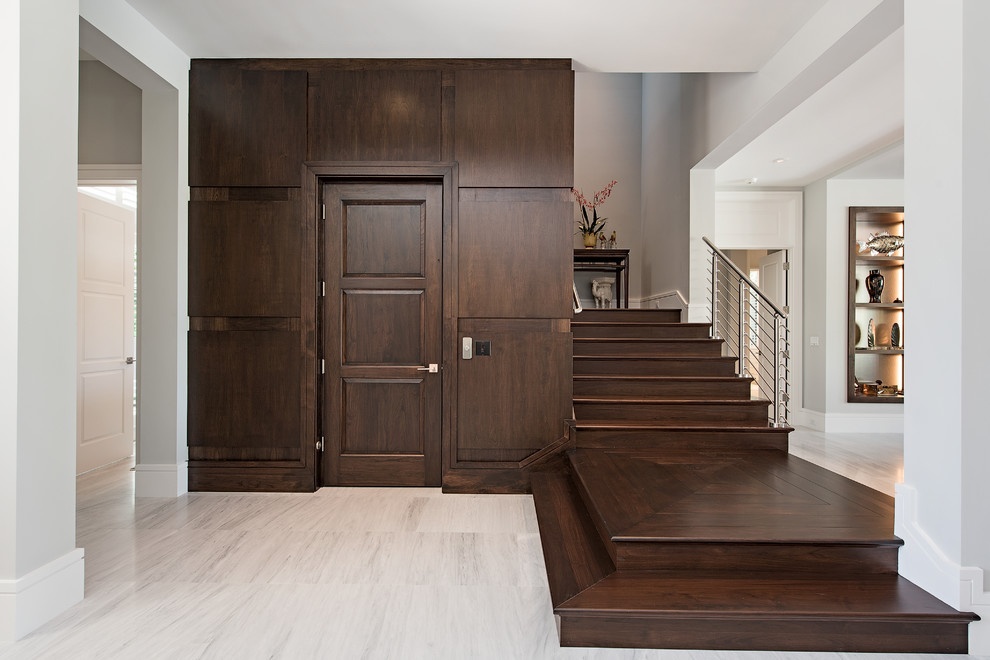 Inspiration for a transitional wooden l-shaped cable railing staircase remodel in Miami with wooden risers