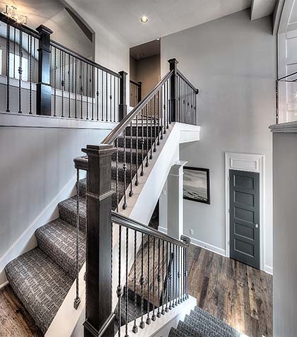 Inspiration for a large timeless carpeted staircase remodel in Kansas City with wooden risers