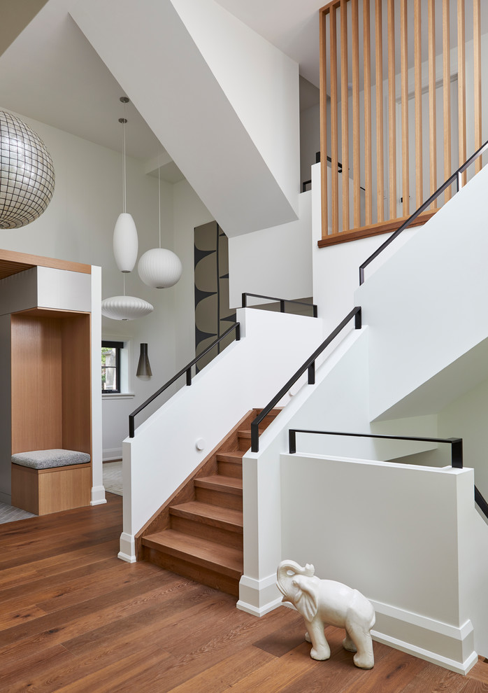 Contemporary wood l-shaped mixed railing staircase in Toronto with wood risers.