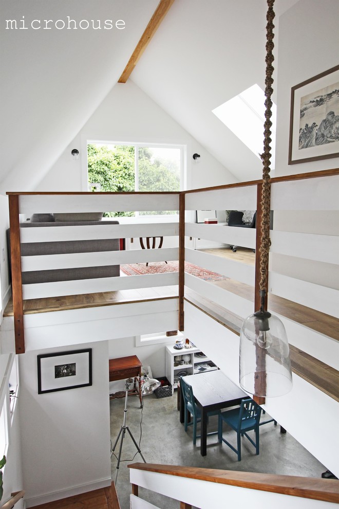 Inspiration for a small contemporary wood l-shaped staircase in Seattle with open risers.