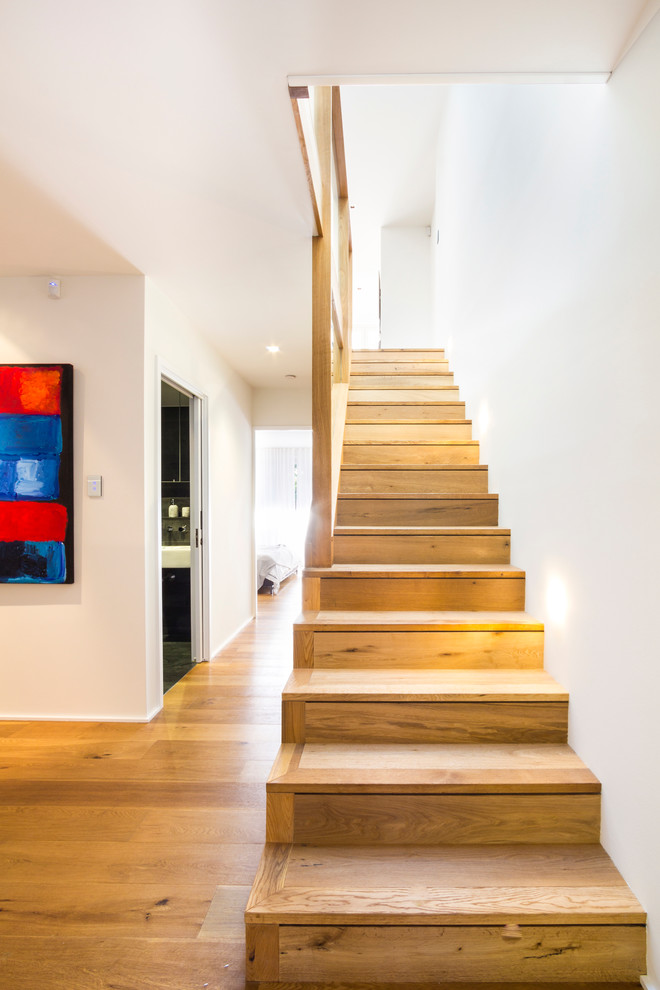 Staircase - contemporary wooden straight staircase idea in Sydney with wooden risers