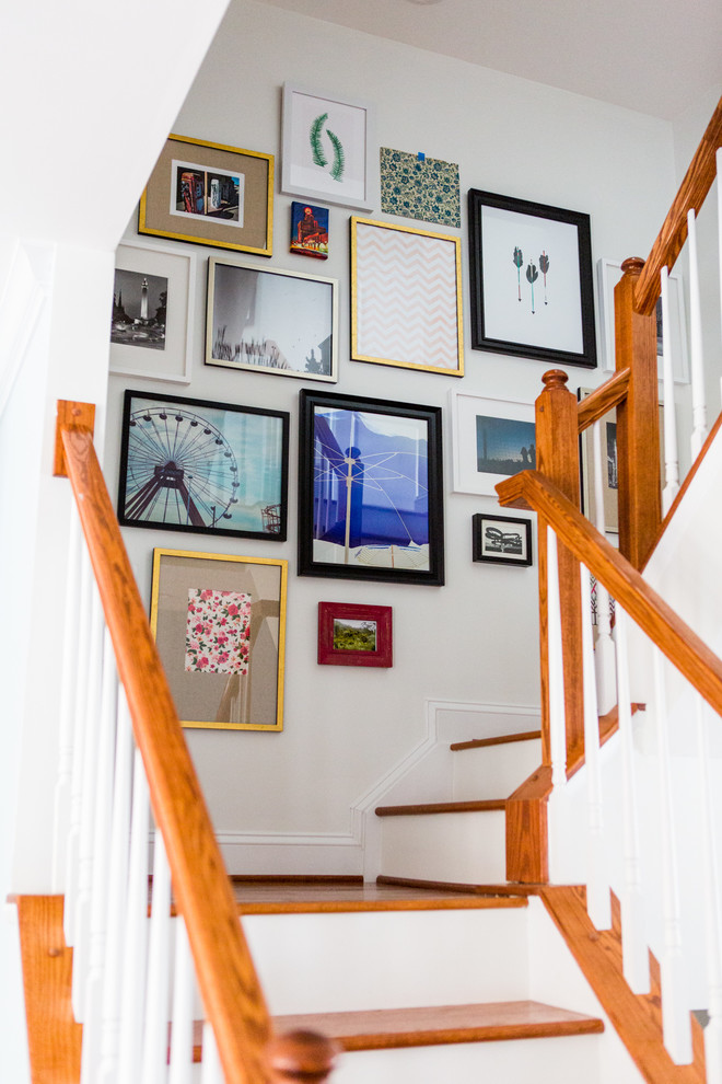 Example of a mid-sized transitional wooden u-shaped staircase design in Baltimore with wooden risers
