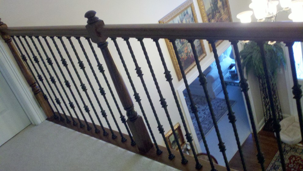 Inspiration for a large modern carpeted straight staircase in Cleveland with carpeted risers.