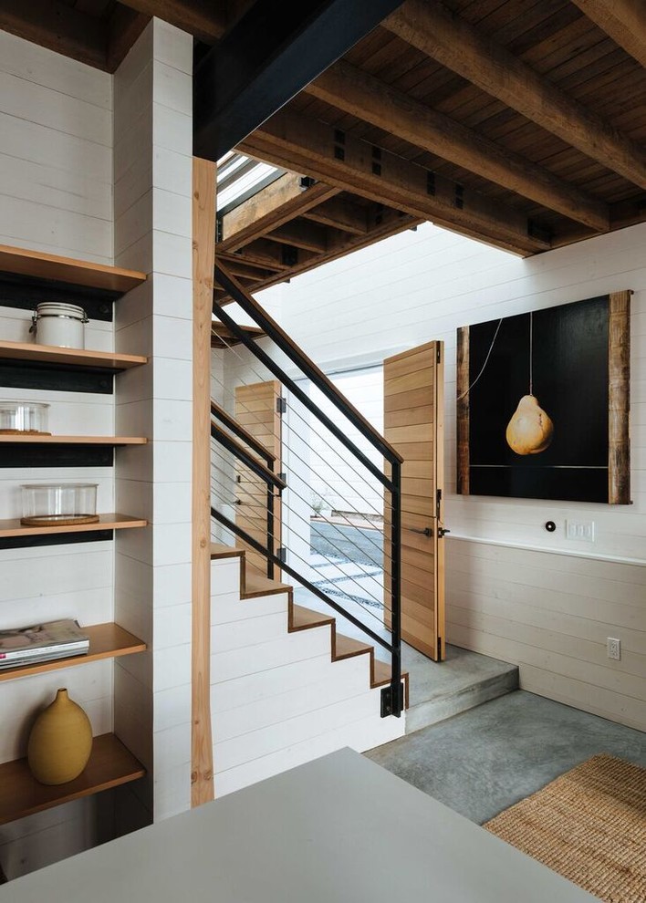 Idée de décoration pour un escalier design en L de taille moyenne avec des marches en bois et des contremarches en bois.