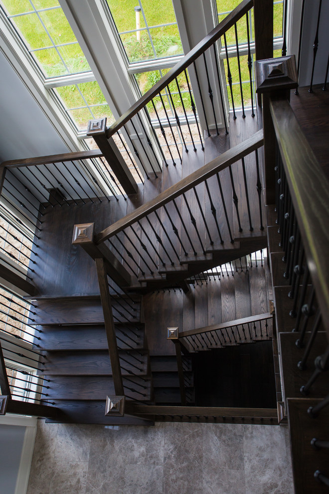 Inspiration pour un très grand escalier flottant minimaliste avec des marches en bois et des contremarches en bois.