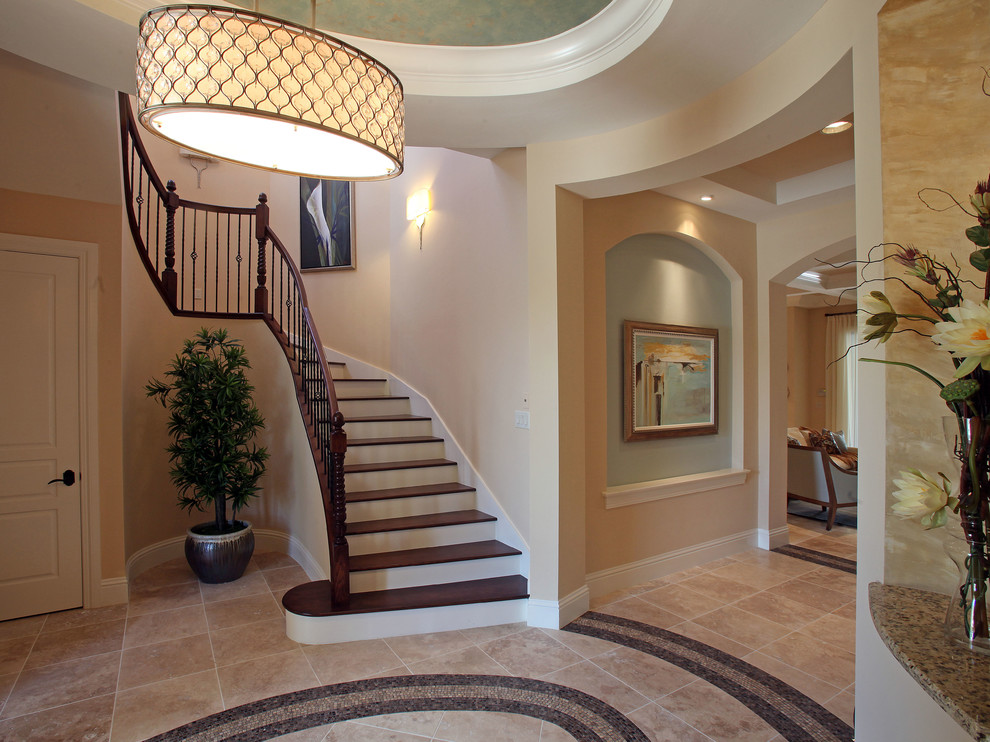 Idée de décoration pour un escalier peint courbe design de taille moyenne avec des marches en bois.